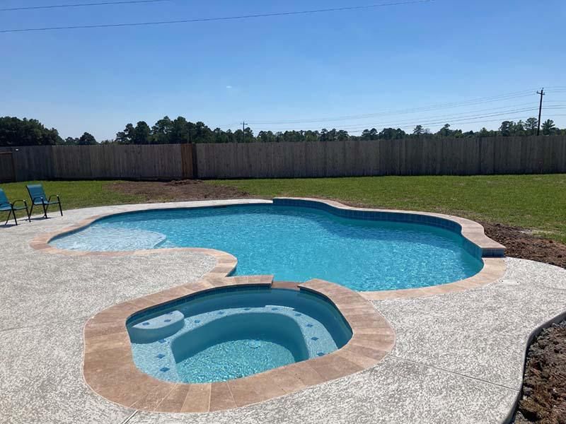 Pool project with landscaping and water